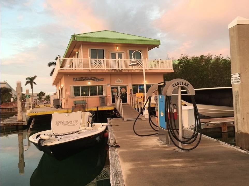 Sunset Marina ship store and fuel dock at sunset on Stock Island